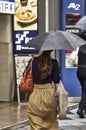 Attractive beautiful lady hold an umbrella.